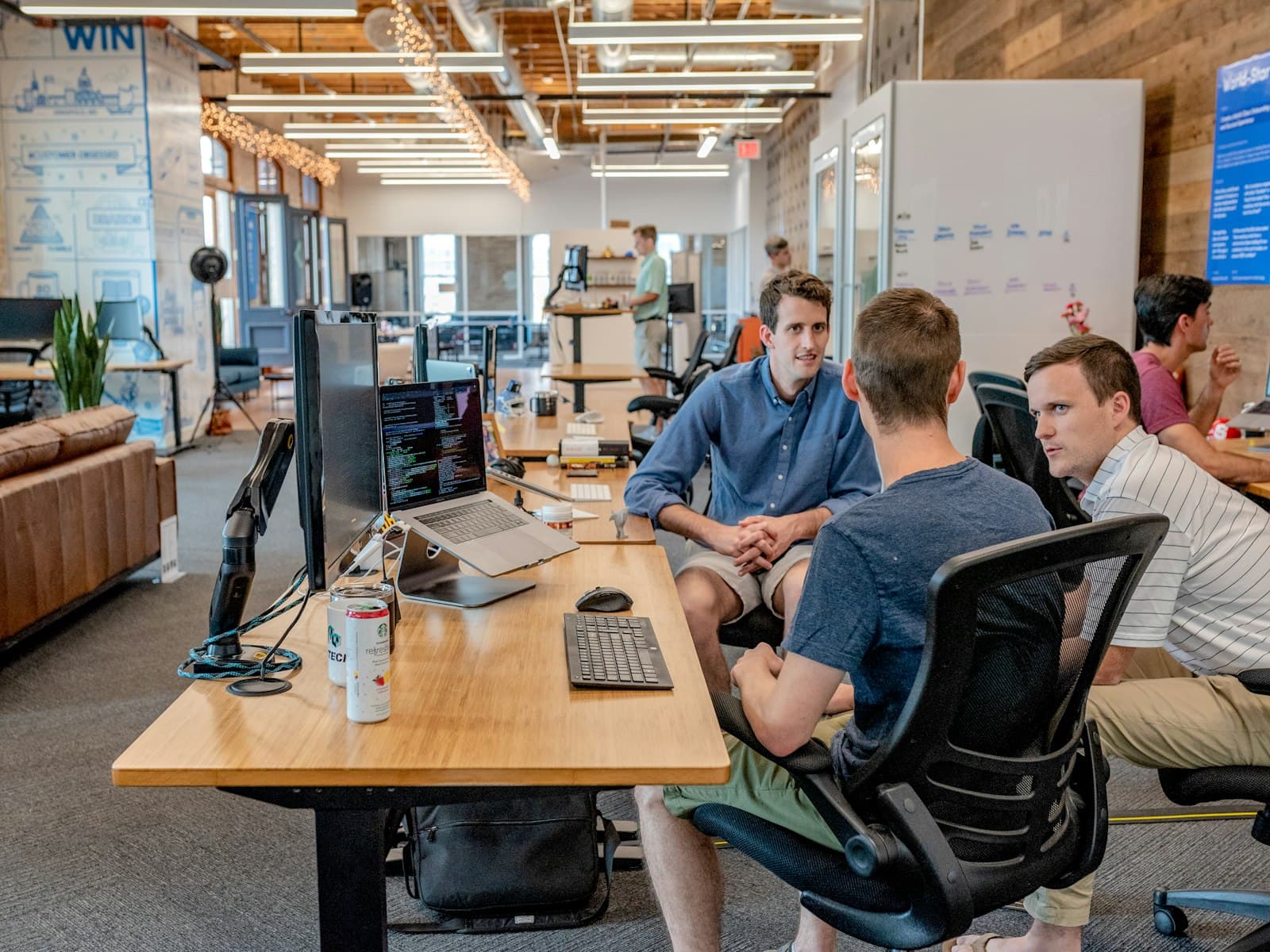 Team discussing a client project in the studio